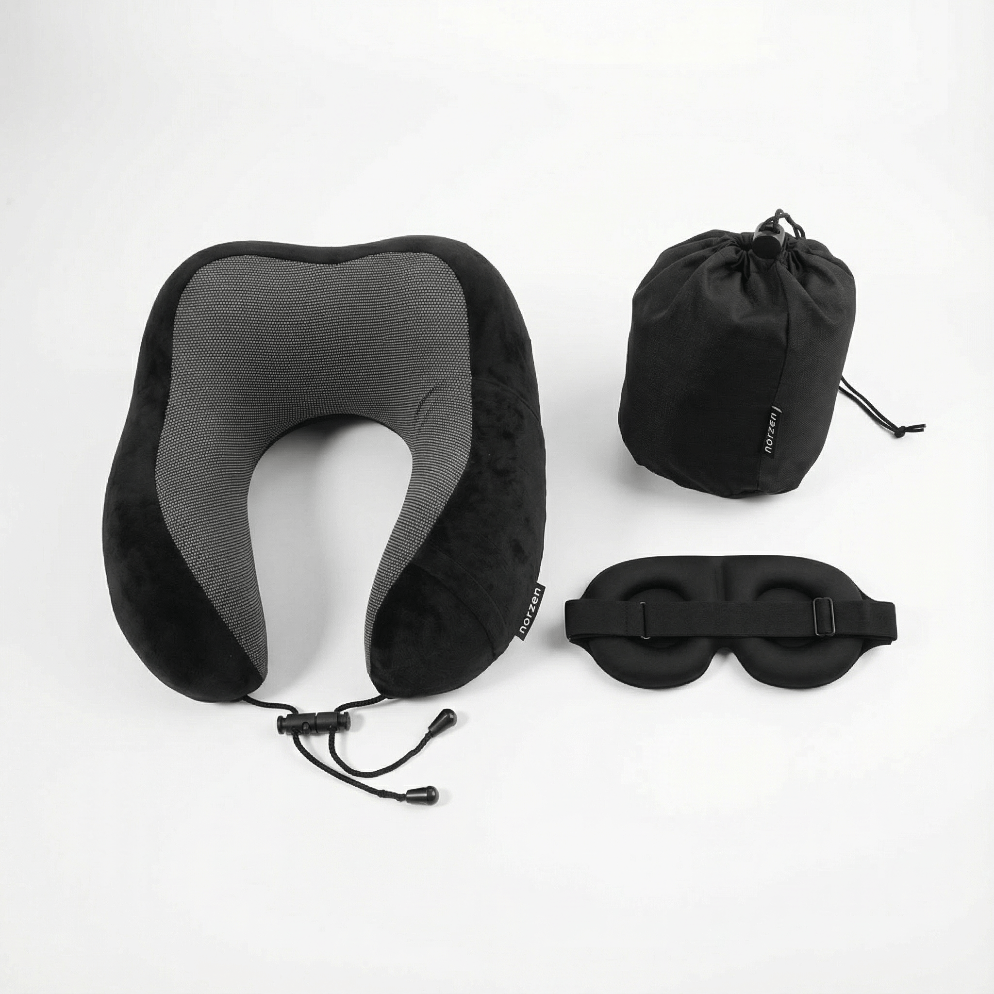 Sort NORZEN reisesett bestående av ergonomisk nakkepute, sovemaske og oppbevaringspose for komfortabel søvn på reise
